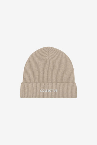 Beige knit beanie with 'Collective' logo on a light gray background