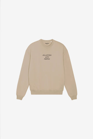 Beige sweatshirt with text on a white background